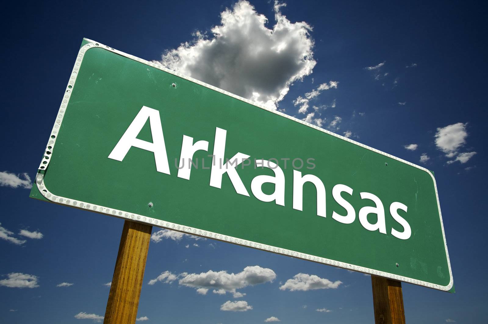 Arkansas Road Sign with dramatic clouds and sky.