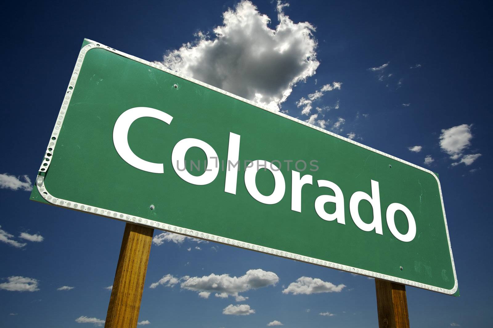 Colorado Road Sign with dramatic clouds and sky.