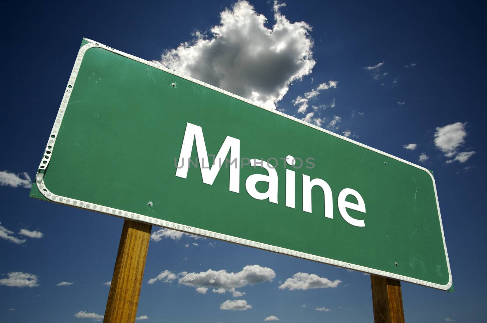 Maine Road Sign with dramatic clouds and sky.