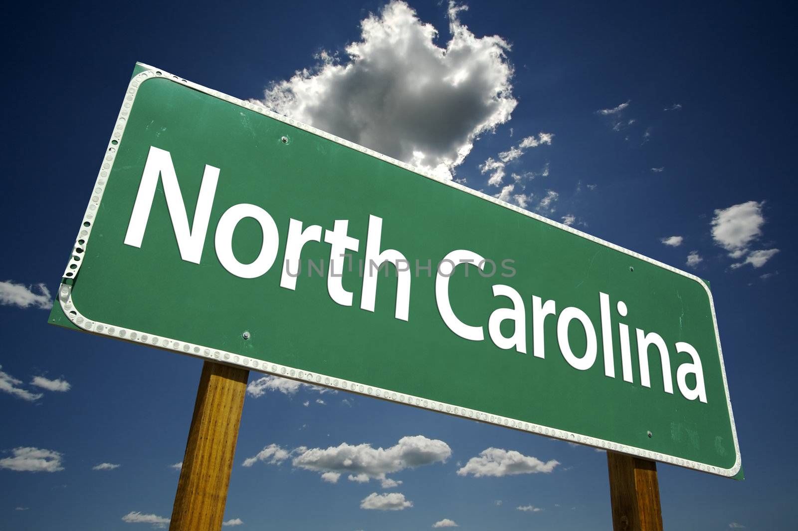 North Carolina Road Sign with dramatic clouds and sky.