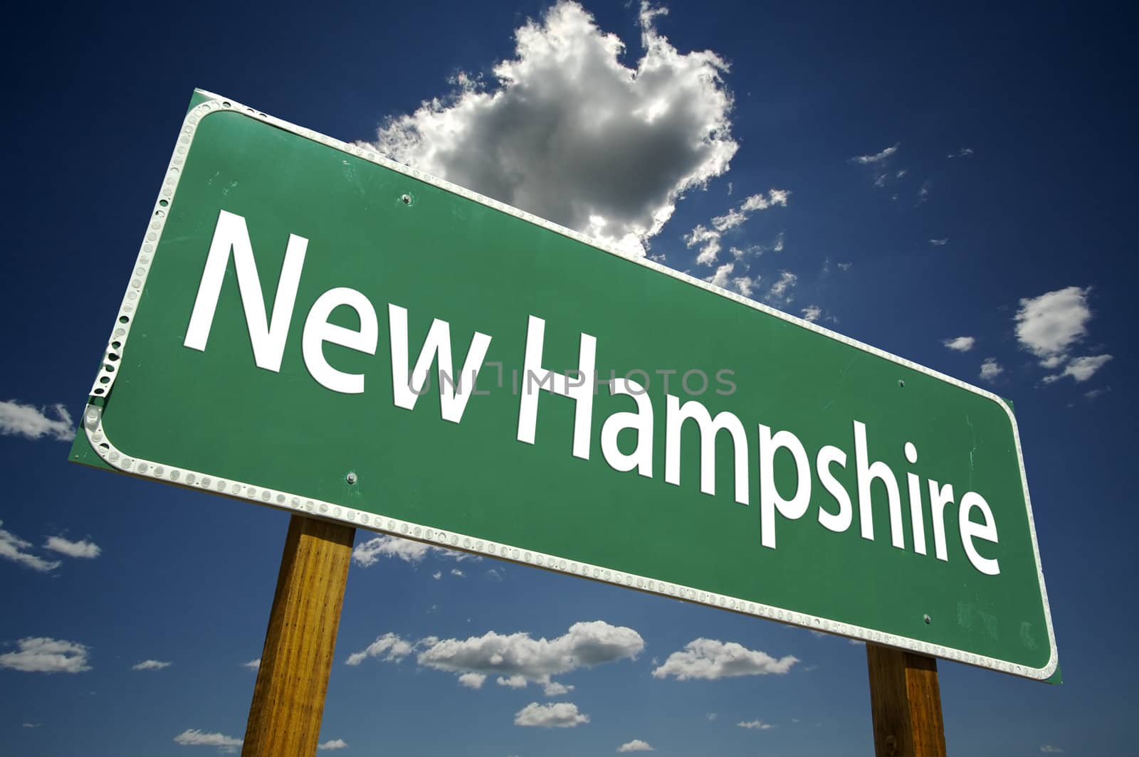 New Hampshire Road Sign with dramatic clouds and sky.