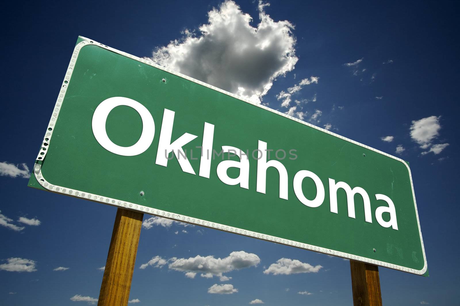 Oklahoma Road Sign with dramatic clouds and sky.