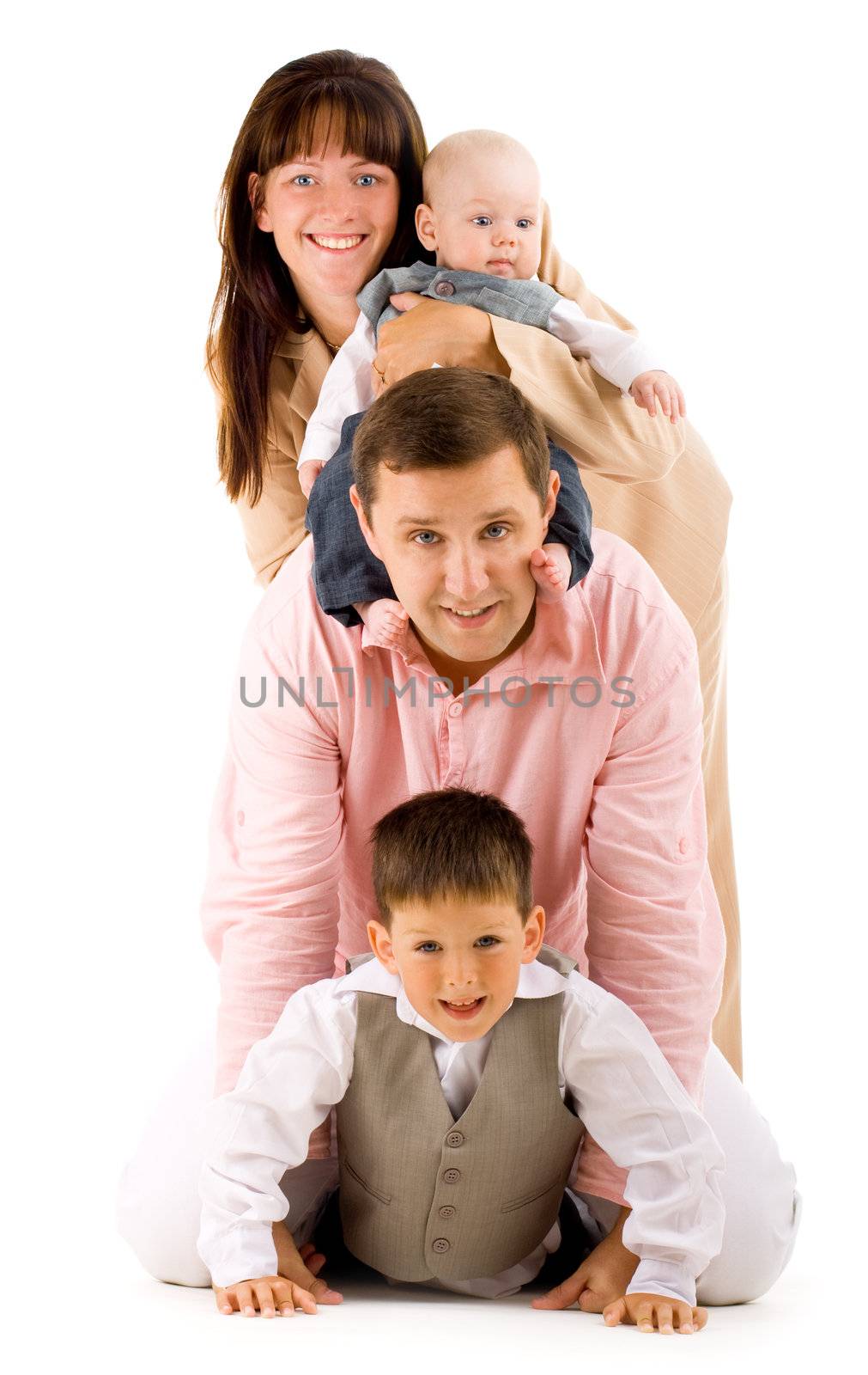 Young happy family with two children on isolated background
