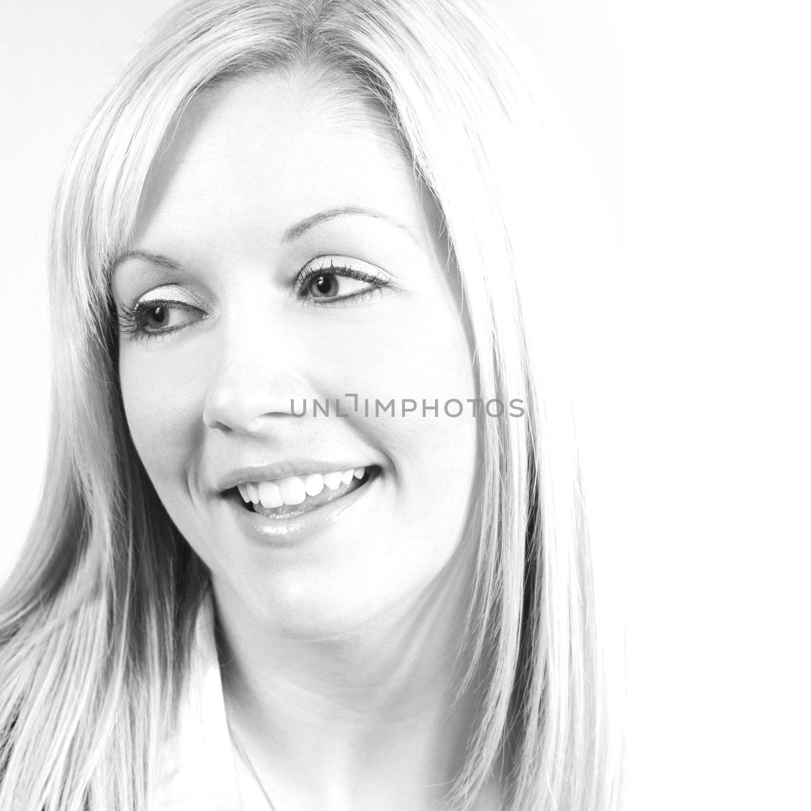 Highkey image of a beautiful blonde female smiling.
