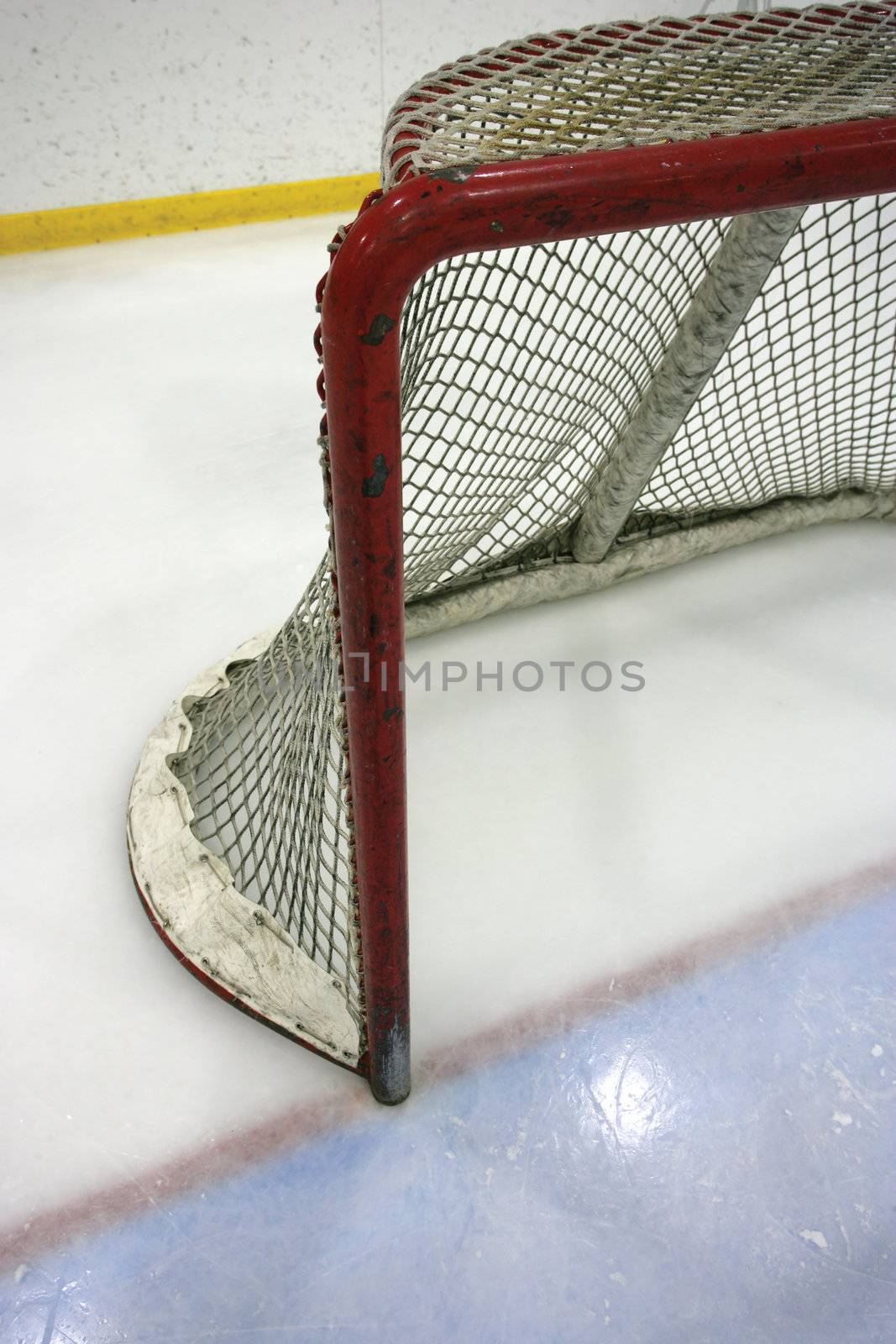Goal post and net in a hockey arena
