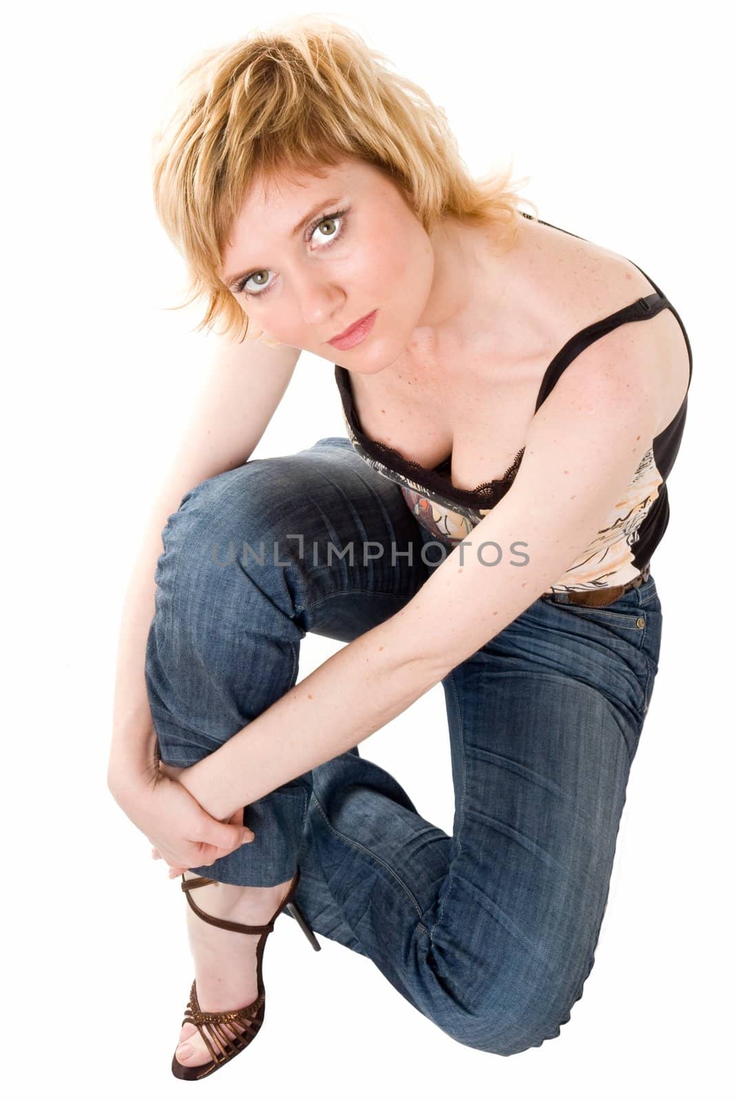 beautiful woman sits on a white background