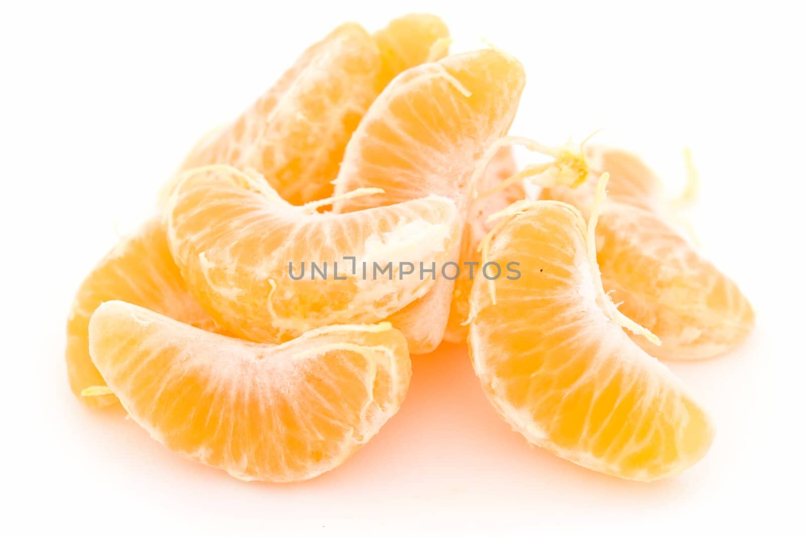 some tangerine segments on a white background