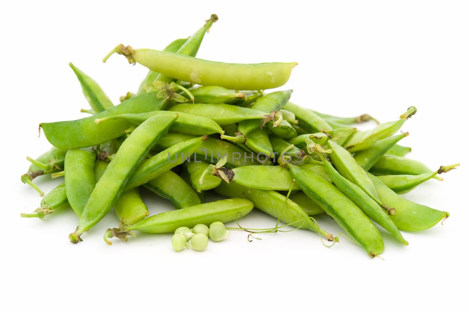 Green peas pods on white a background