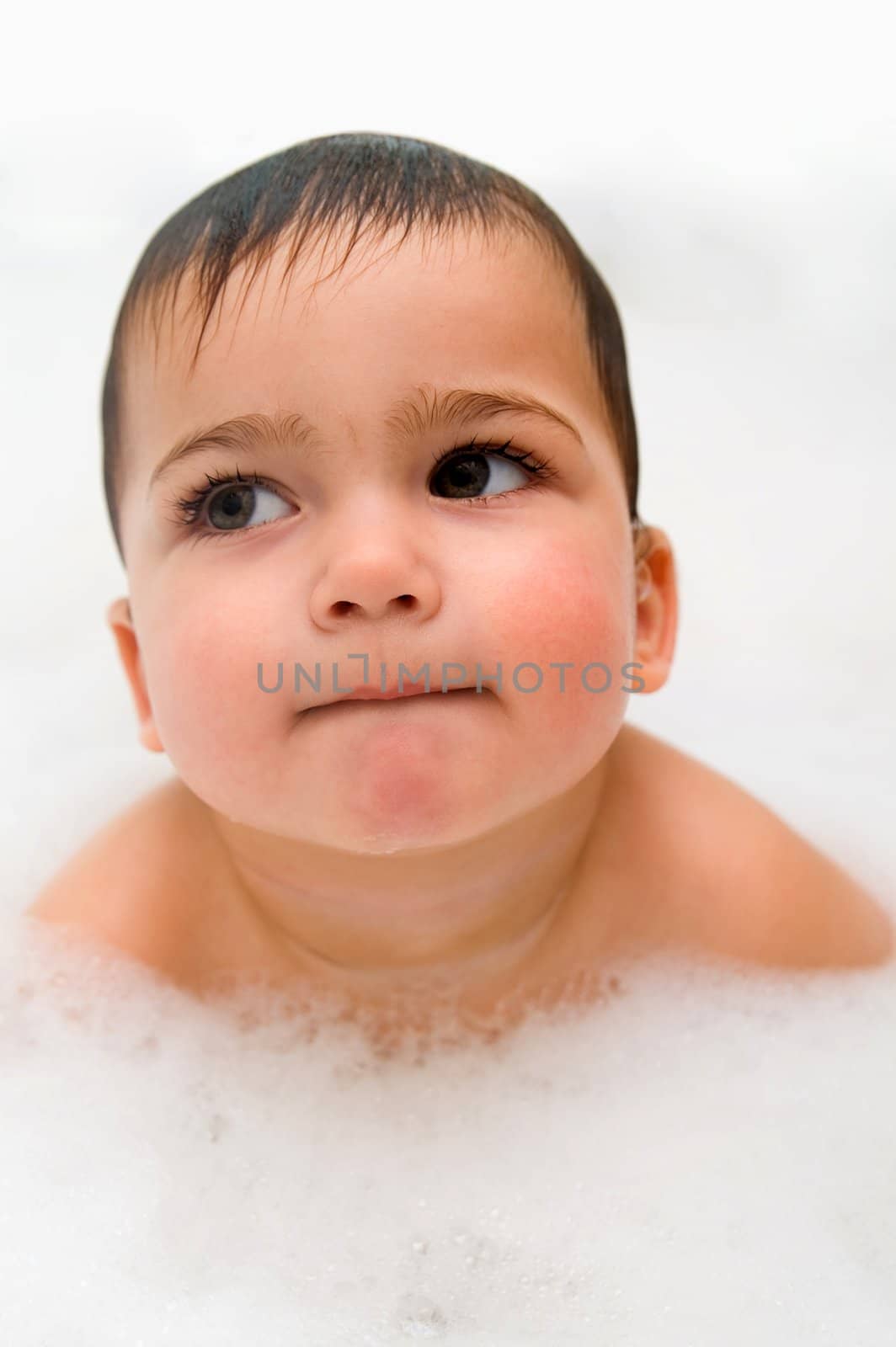 Thoughtful year old boy in foam by lilsla