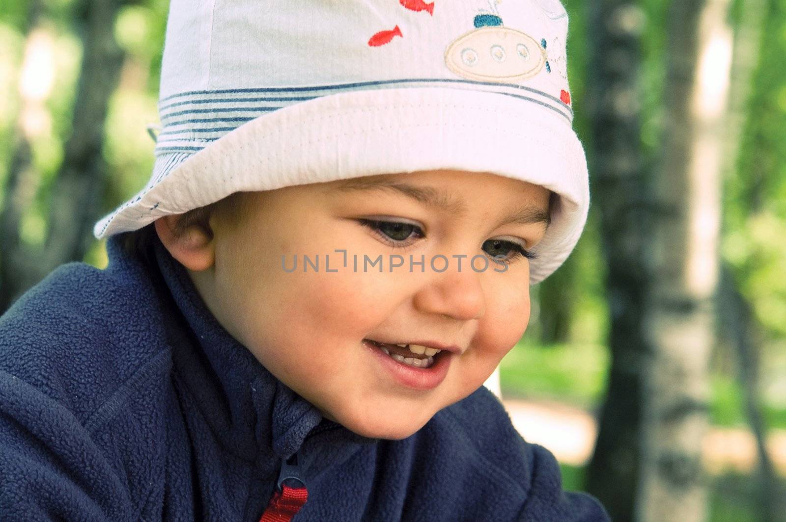 Happy boy in a hat by lilsla