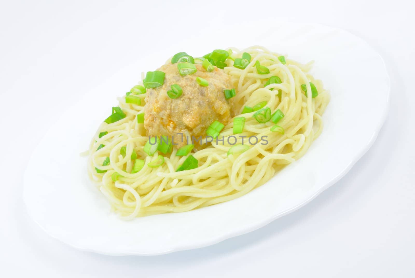 Spaghetti with Meatball and Spring Onions on White Plate  by yarmirina