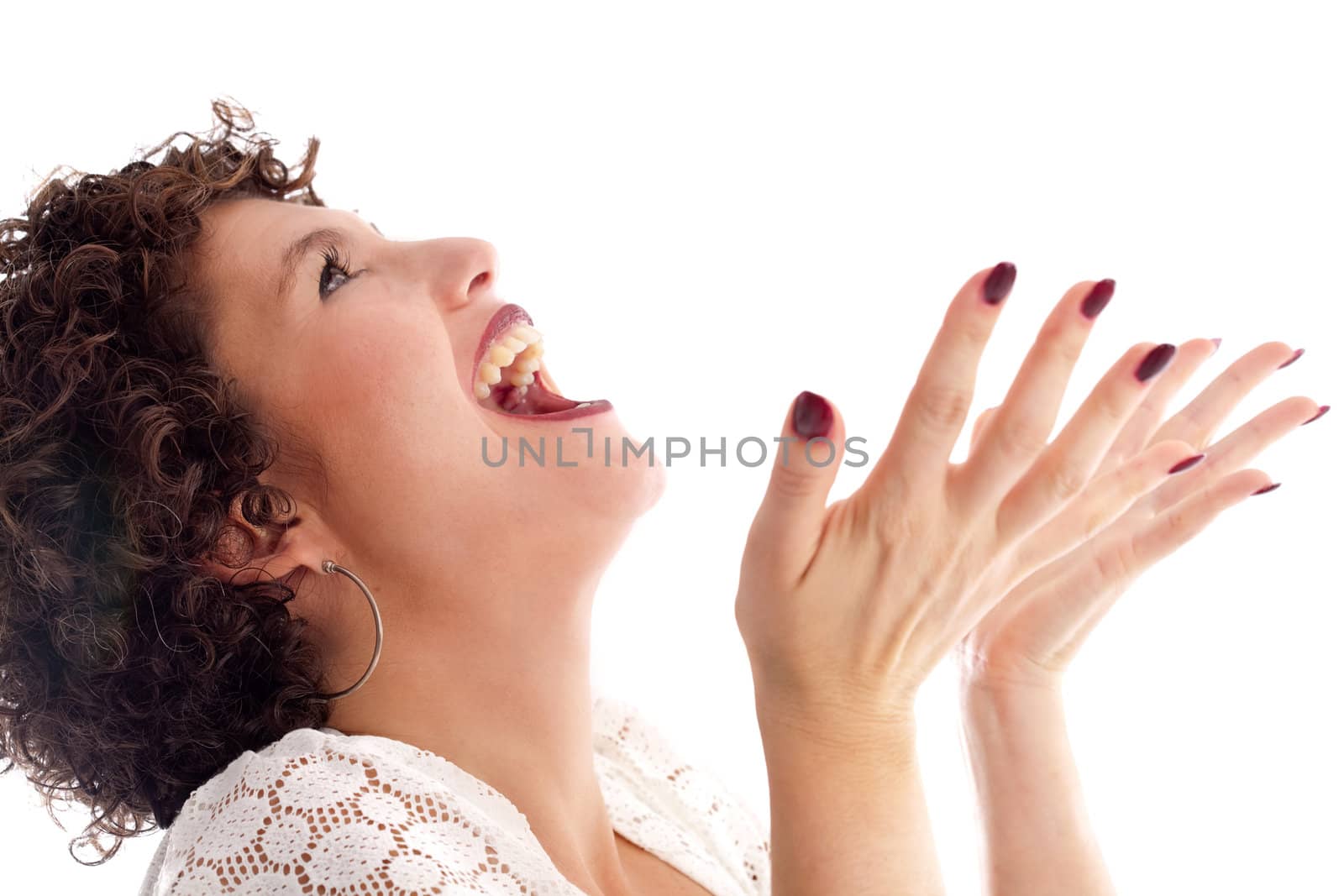 Pretty brunette standing with an excited look on her face and her hands spread open as if to catch something