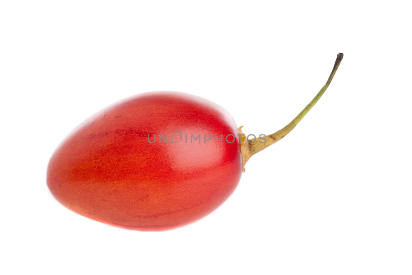 Juicy red tamarillo on white background