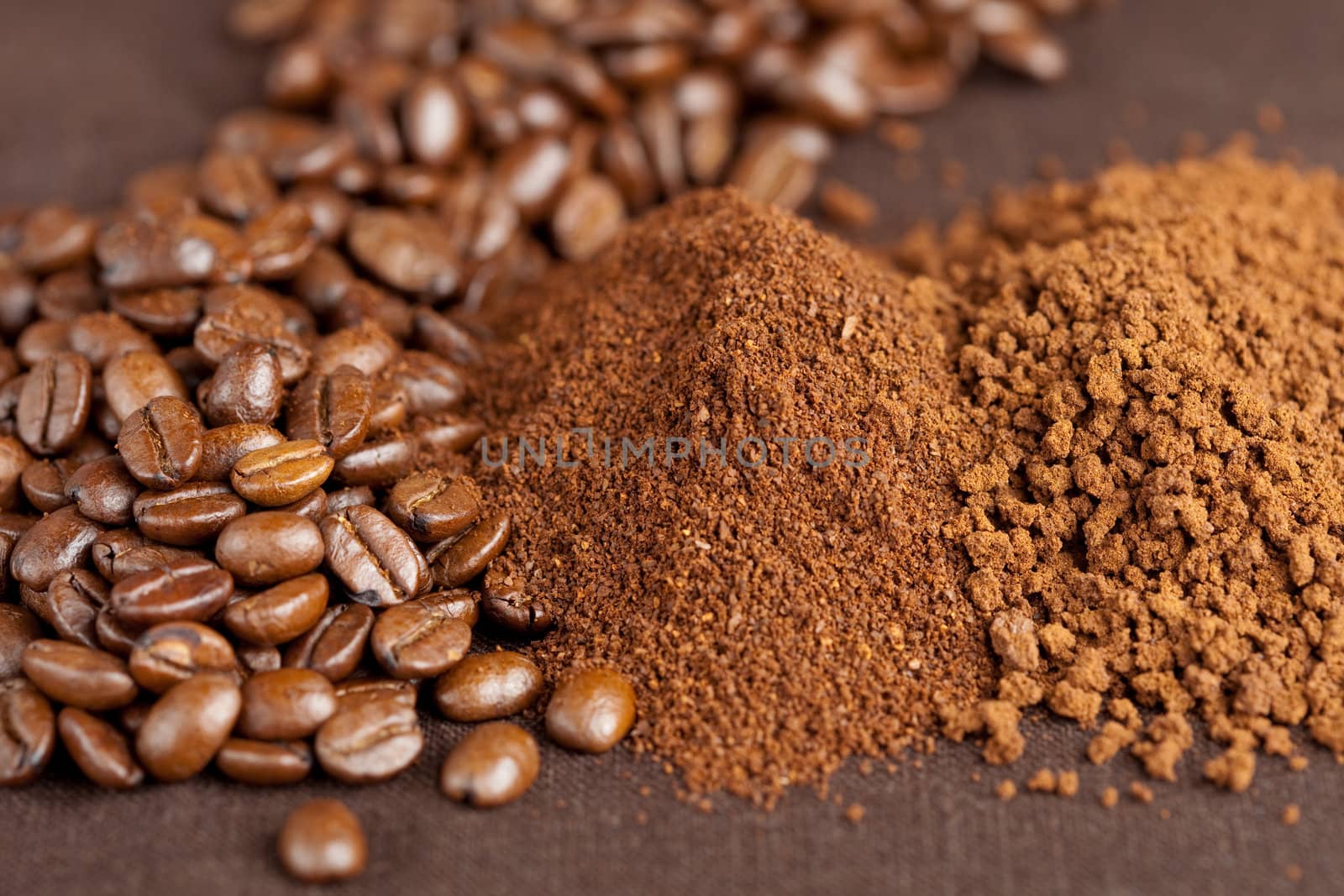 Pile of coffeebeans, filtercoffee and instant coffee