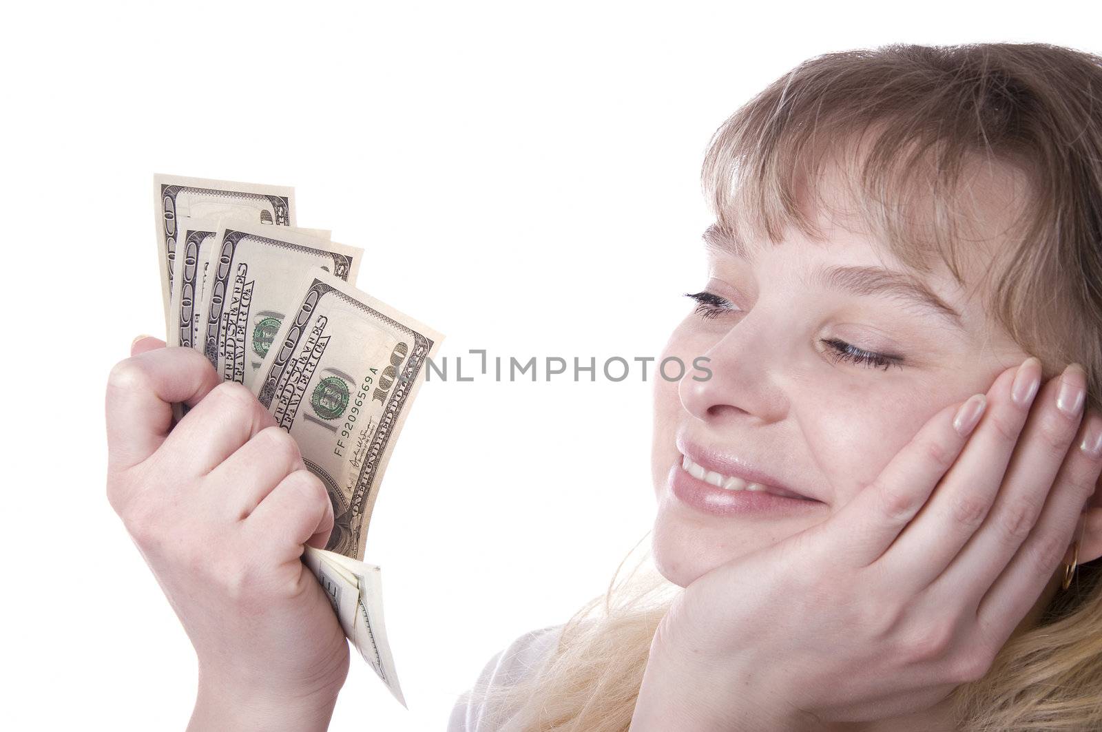 Beautiful young woman holding money  by jordano