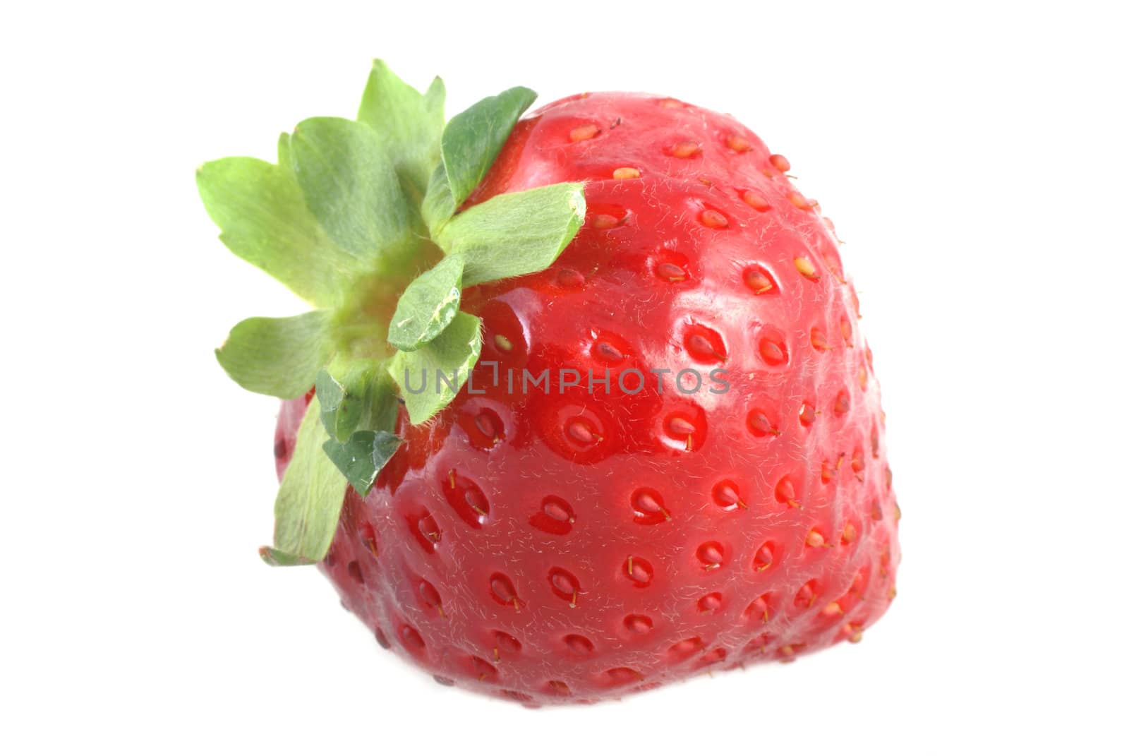 One colorful strawberry isolated on a white background.