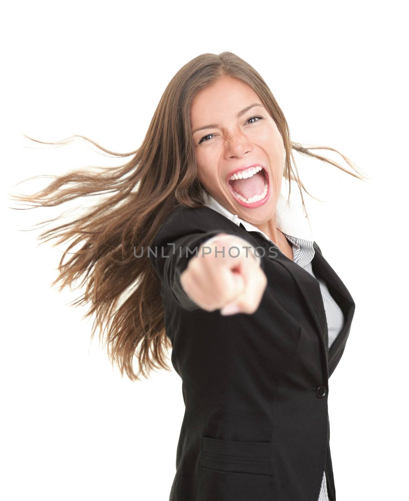 Excited young businesswoman pointing at camera. Beautiful young mixed race asian / caucasian woman in suit isolated on white background.