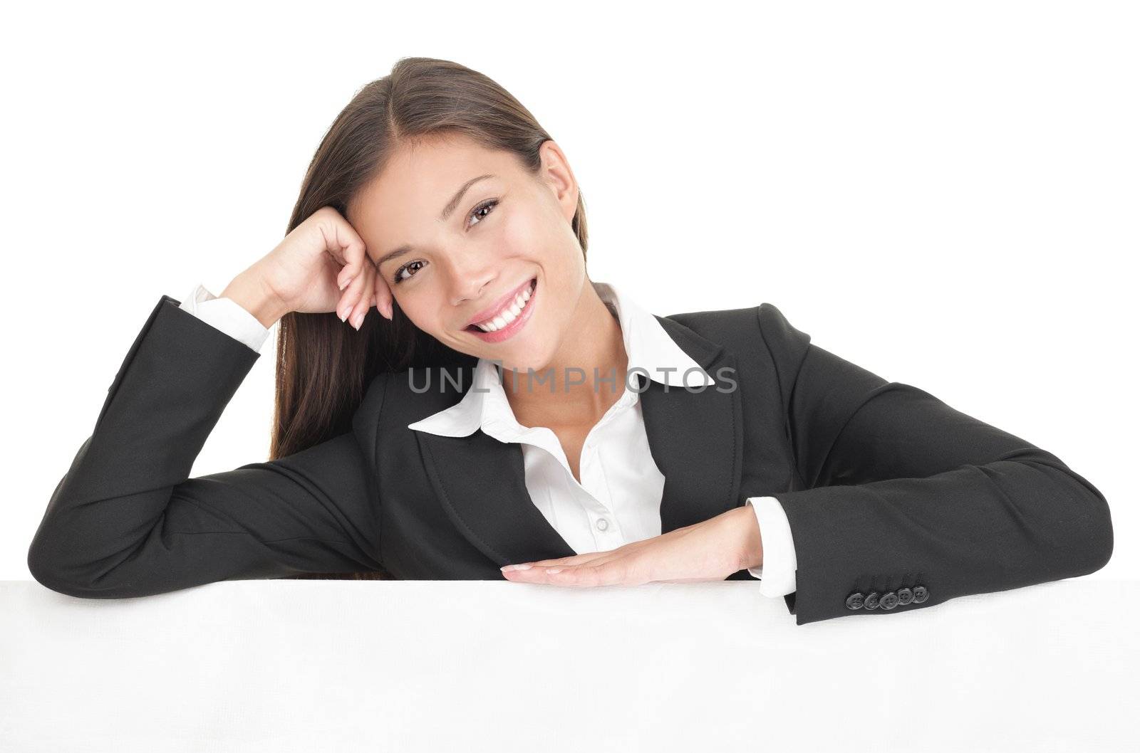 Billboard sign businesswoman. Woman standing leaning casual on a white blank banner / placard. Beautiful mixed race chinese / caucasian model. Isolated on white background.