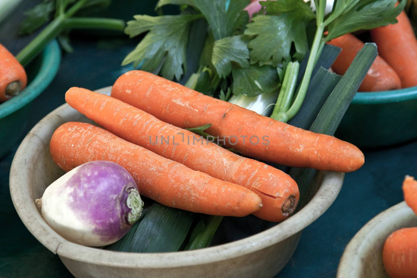 Vegetables for soup with carrots at an outdoor market in Paris France