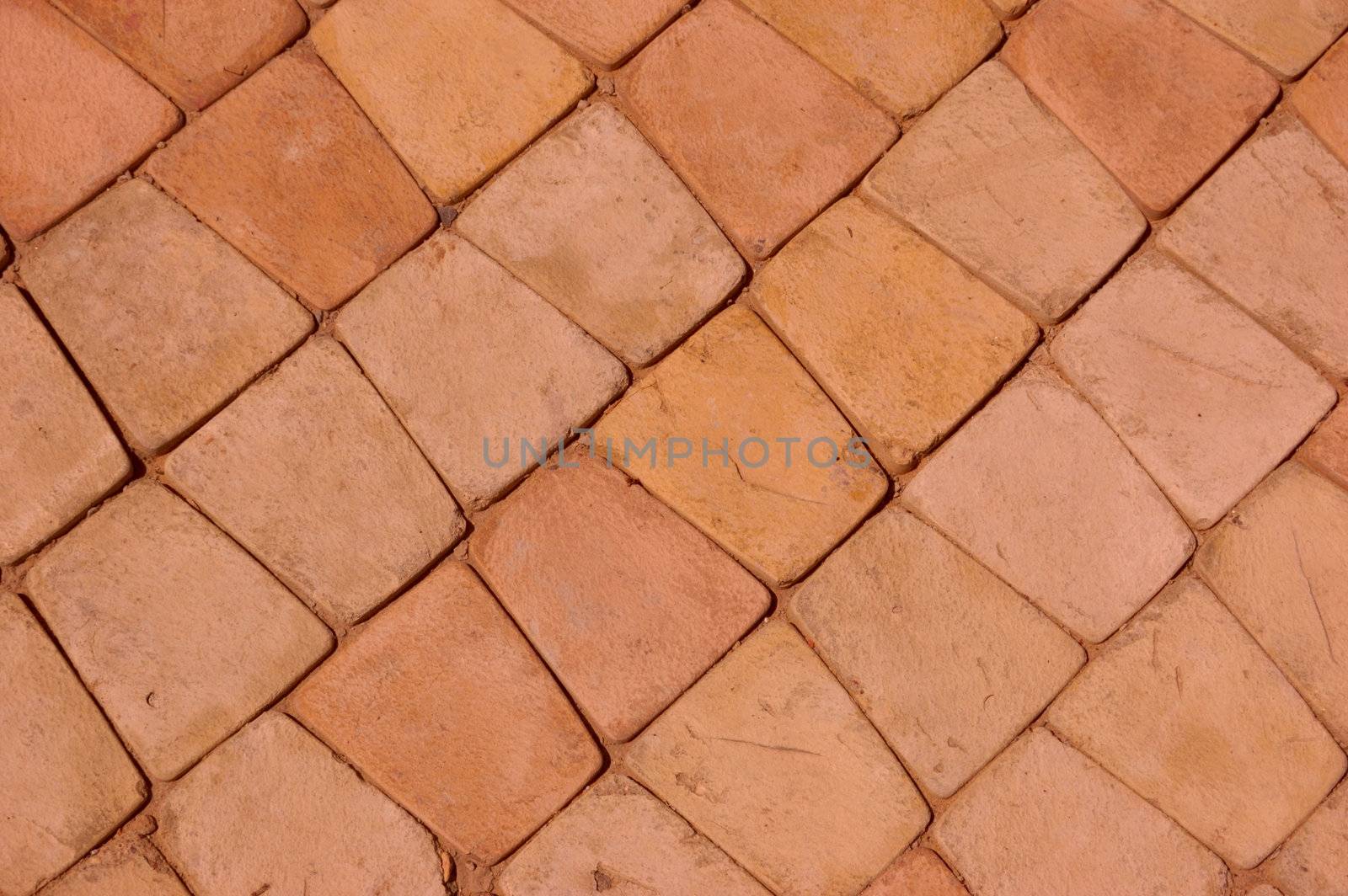 close-up of new pavement of stoneblocks (bricks) of warm color