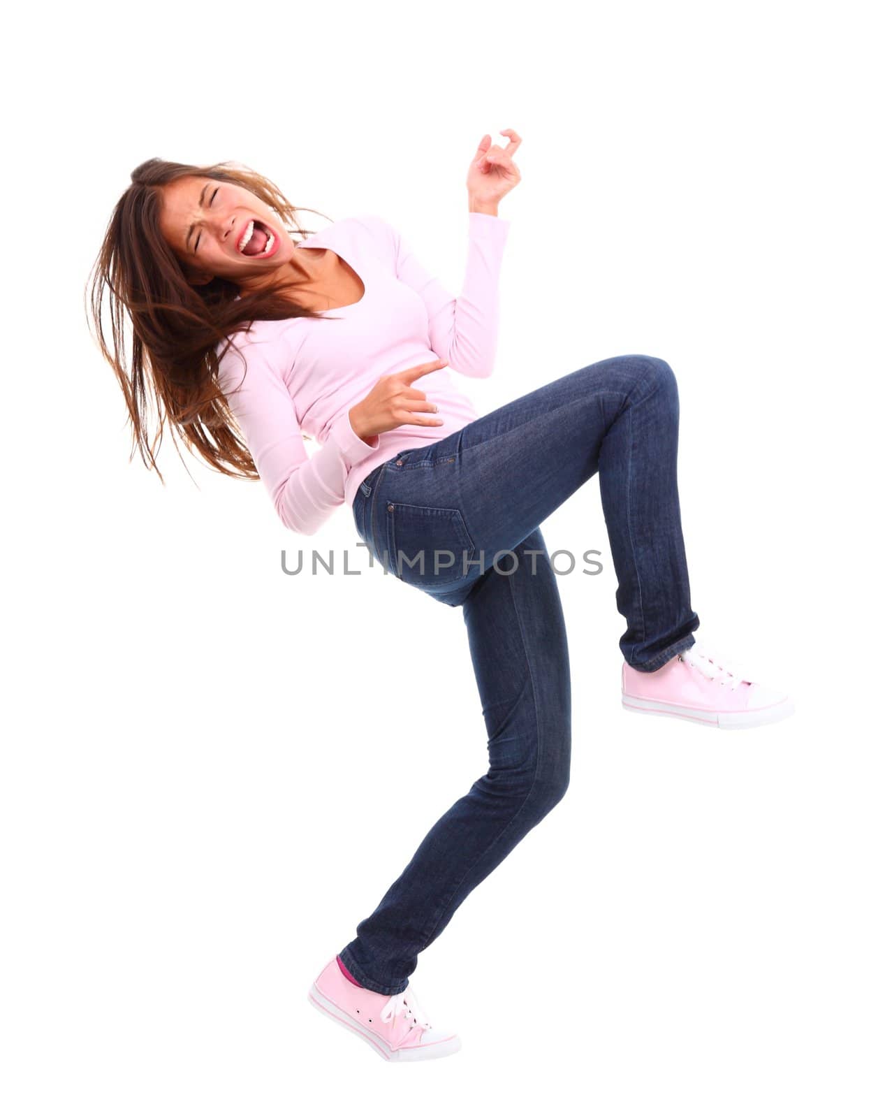 Asian woman intensely playing air guitar. Isolated on white background. Mixed race chinese / caucasian model.