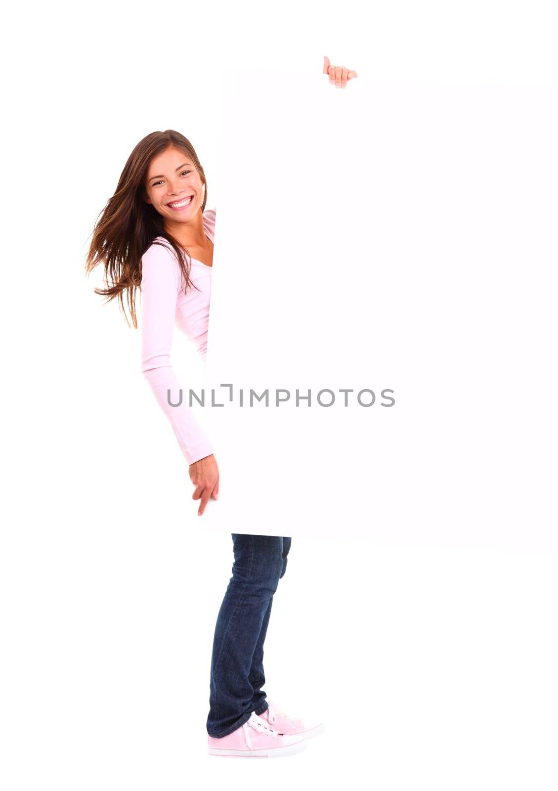 Beautiful woman holding sign. Dynamic full length image of woman holding a white blank board / placard. Beautiful mixed race chinese / caucasian model. Isolated on white background.