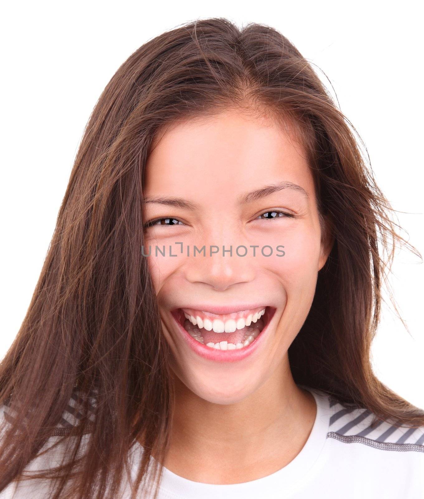Sporty asian woman with a grin after exercise. Isolated on white background. Mixed race chinese / caucasian model.