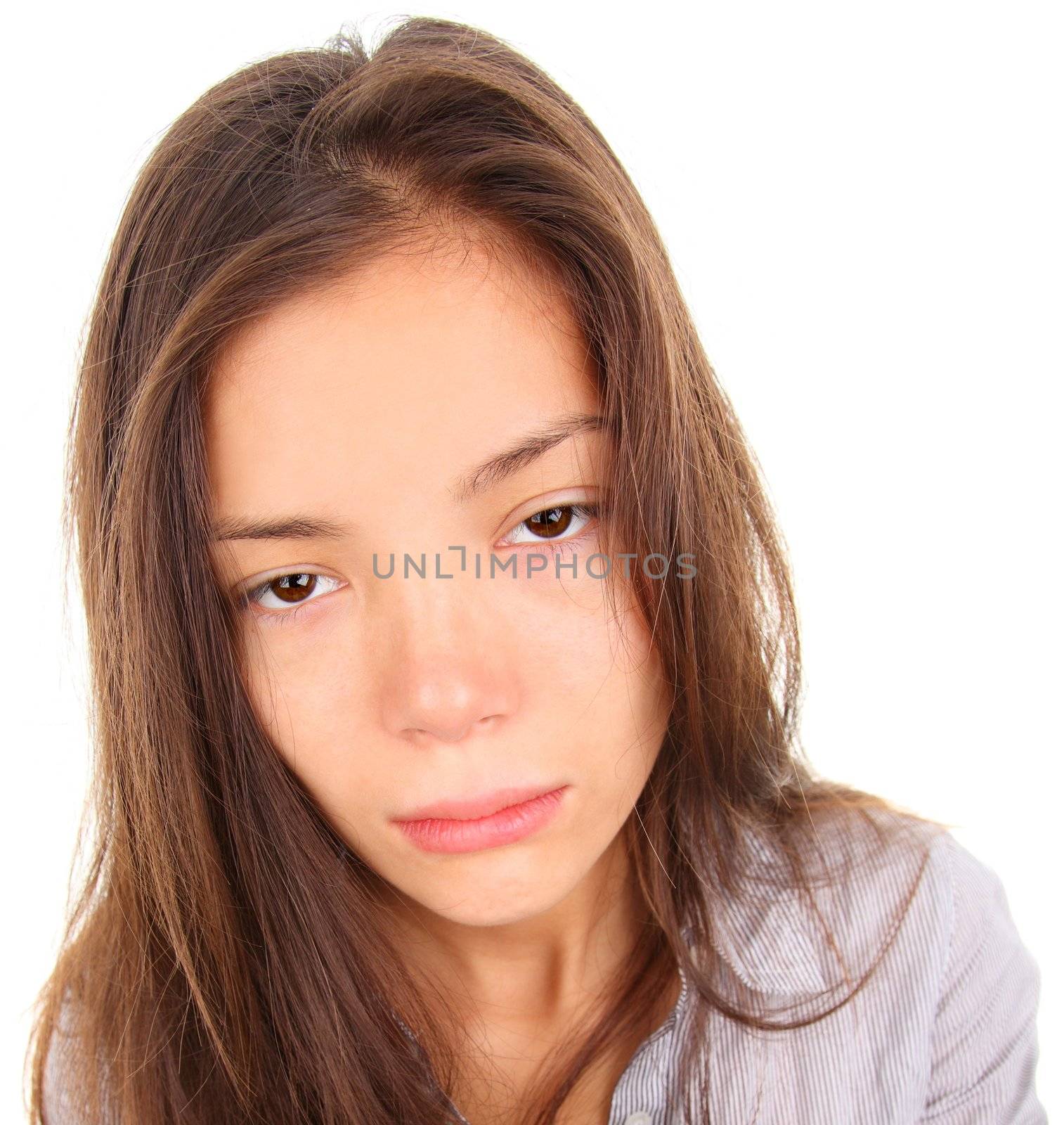 Tired woman with empty and bored eyes. Mixed race asian / caucasian model isolated on white background.