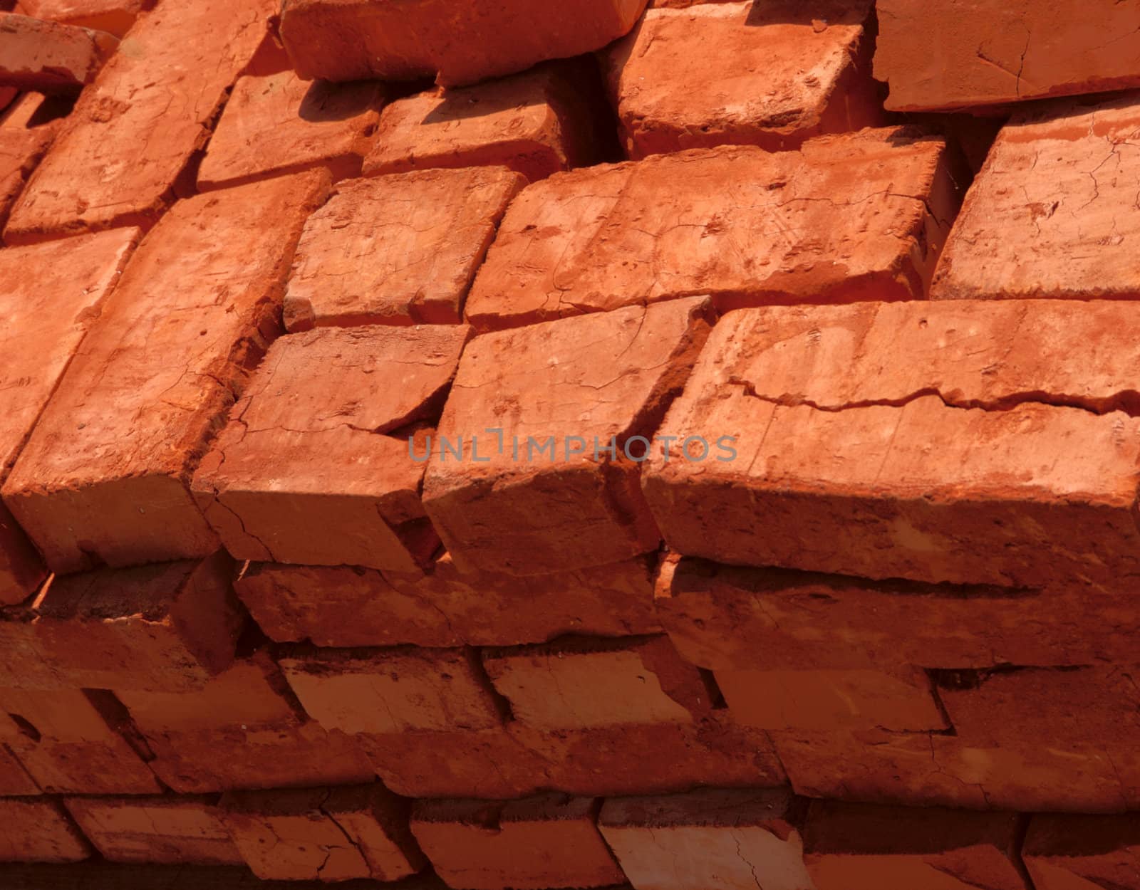 stack of baked bricks with red surface