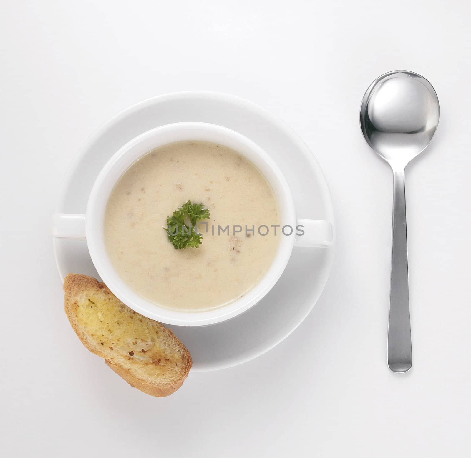 creamy soup with parsley ready to serve