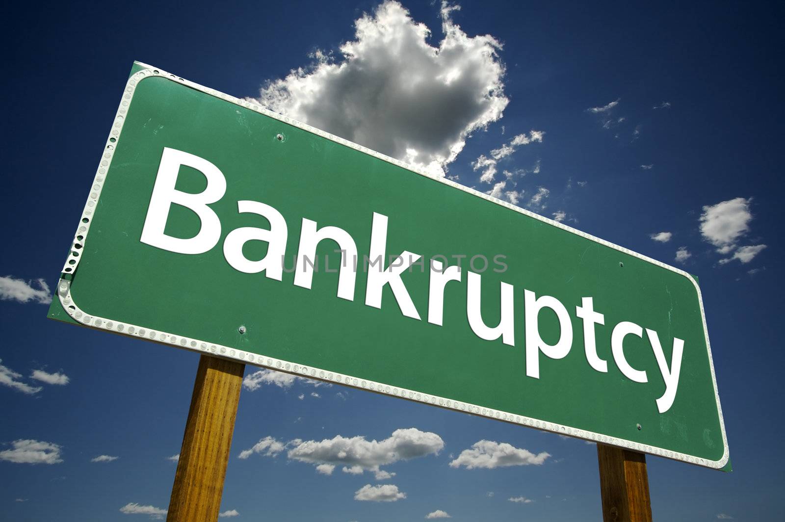 Bankruptcy Road Sign with dramatic clouds and sky.