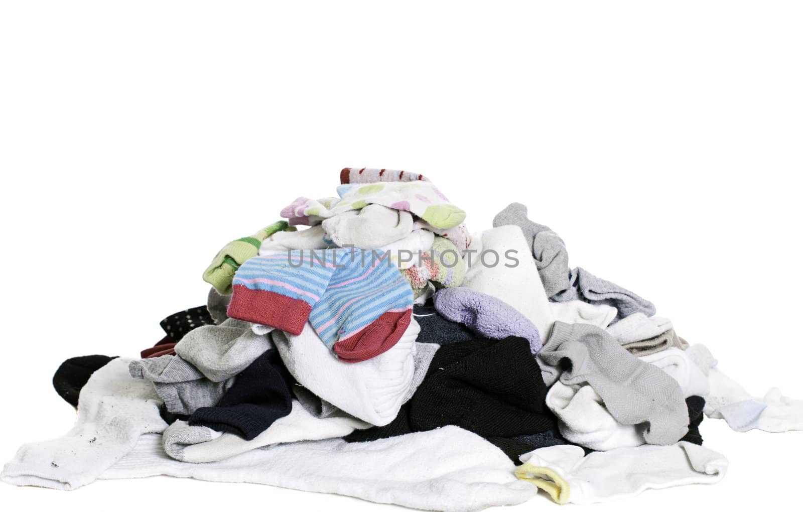 A pile of unsorted socks, isolated against a white background