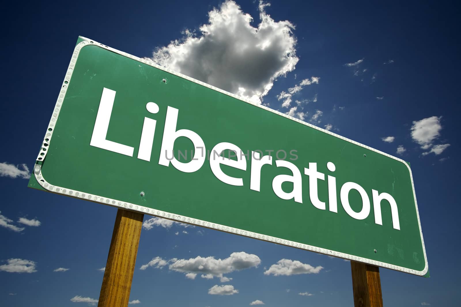 Liberation Road Sign with dramatic clouds and sky.
