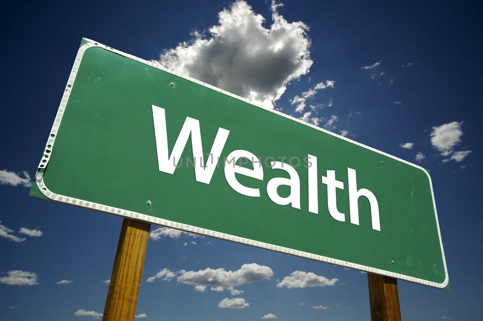 Wealth Road Sign with dramatic clouds and sky.