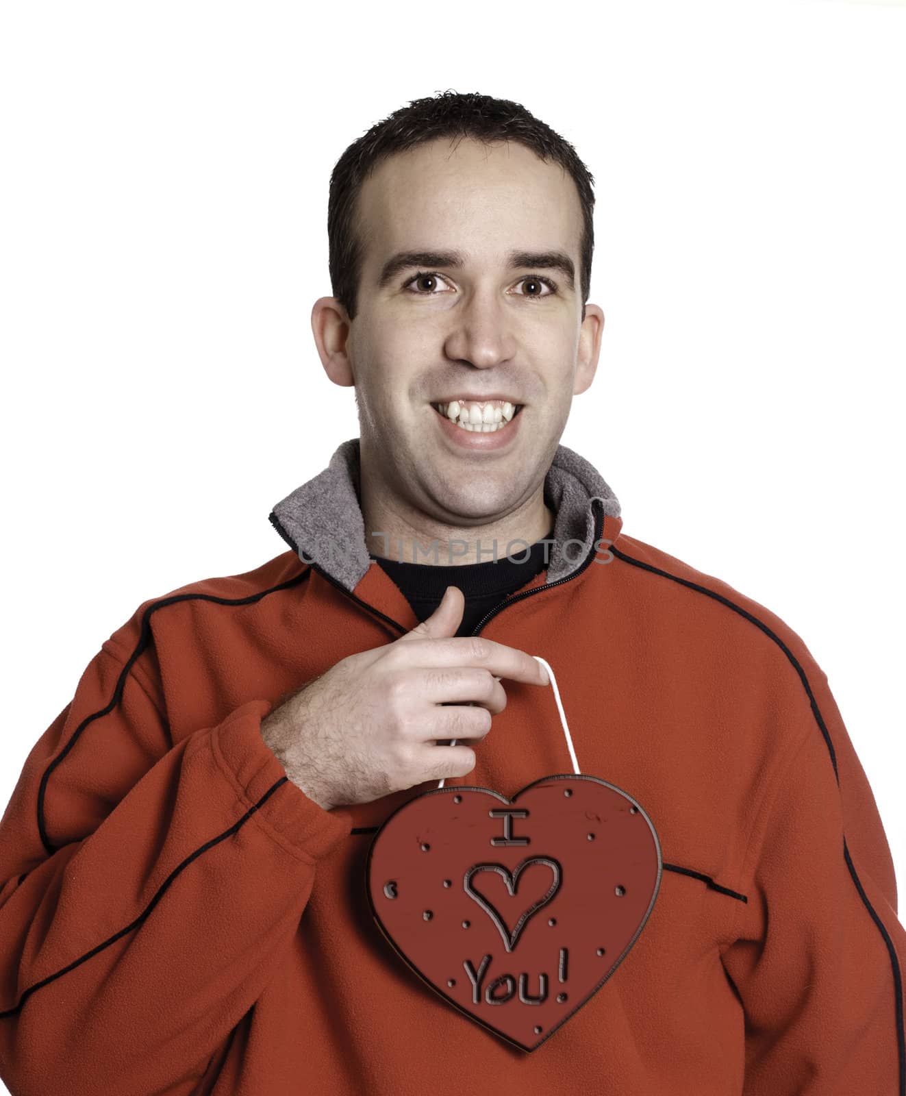 Man holding a heart with the words, "I love you" on a wooden heart, isolated against a white background.