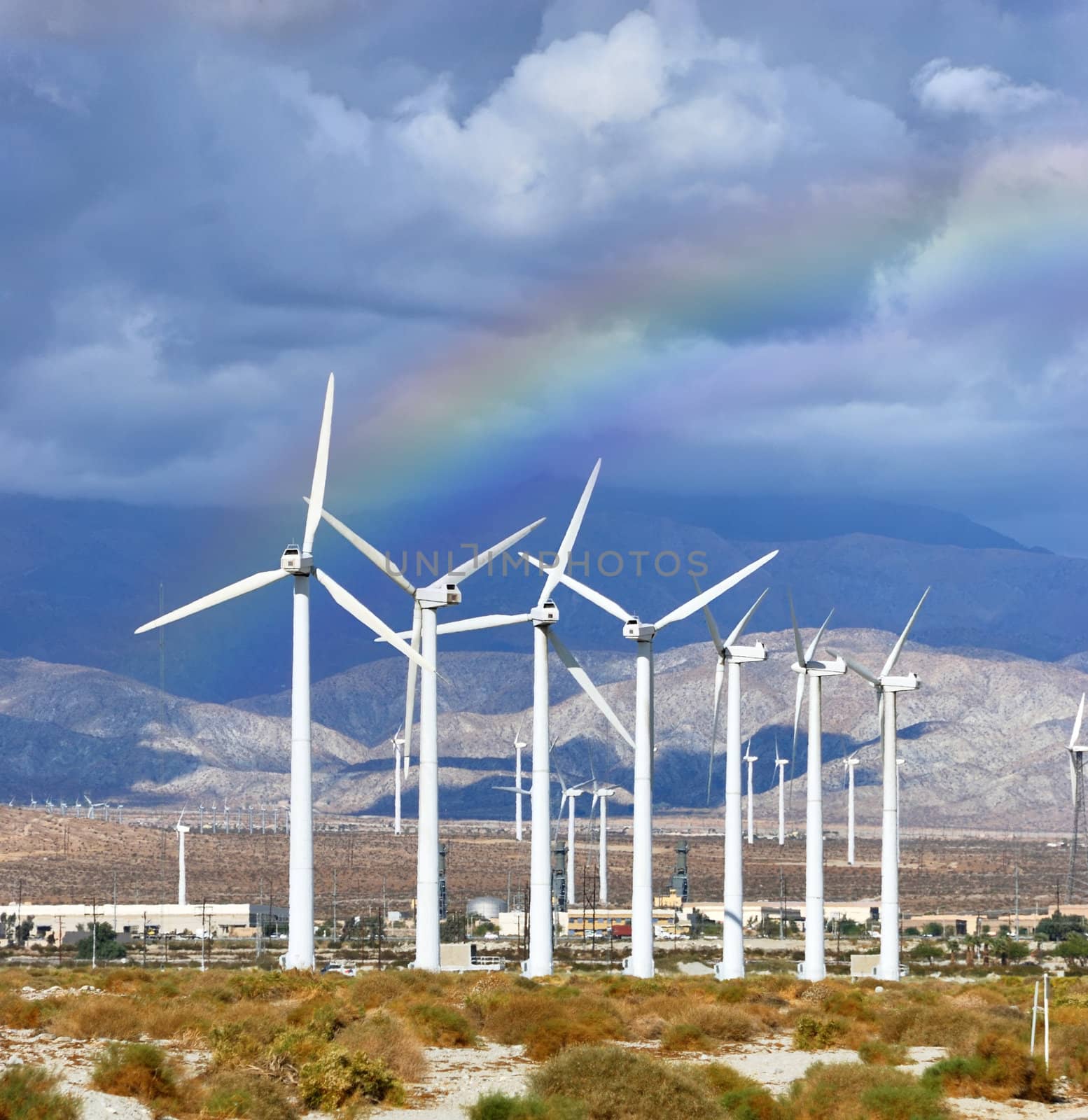 Windmills rotating and producing clean energy, electric power.