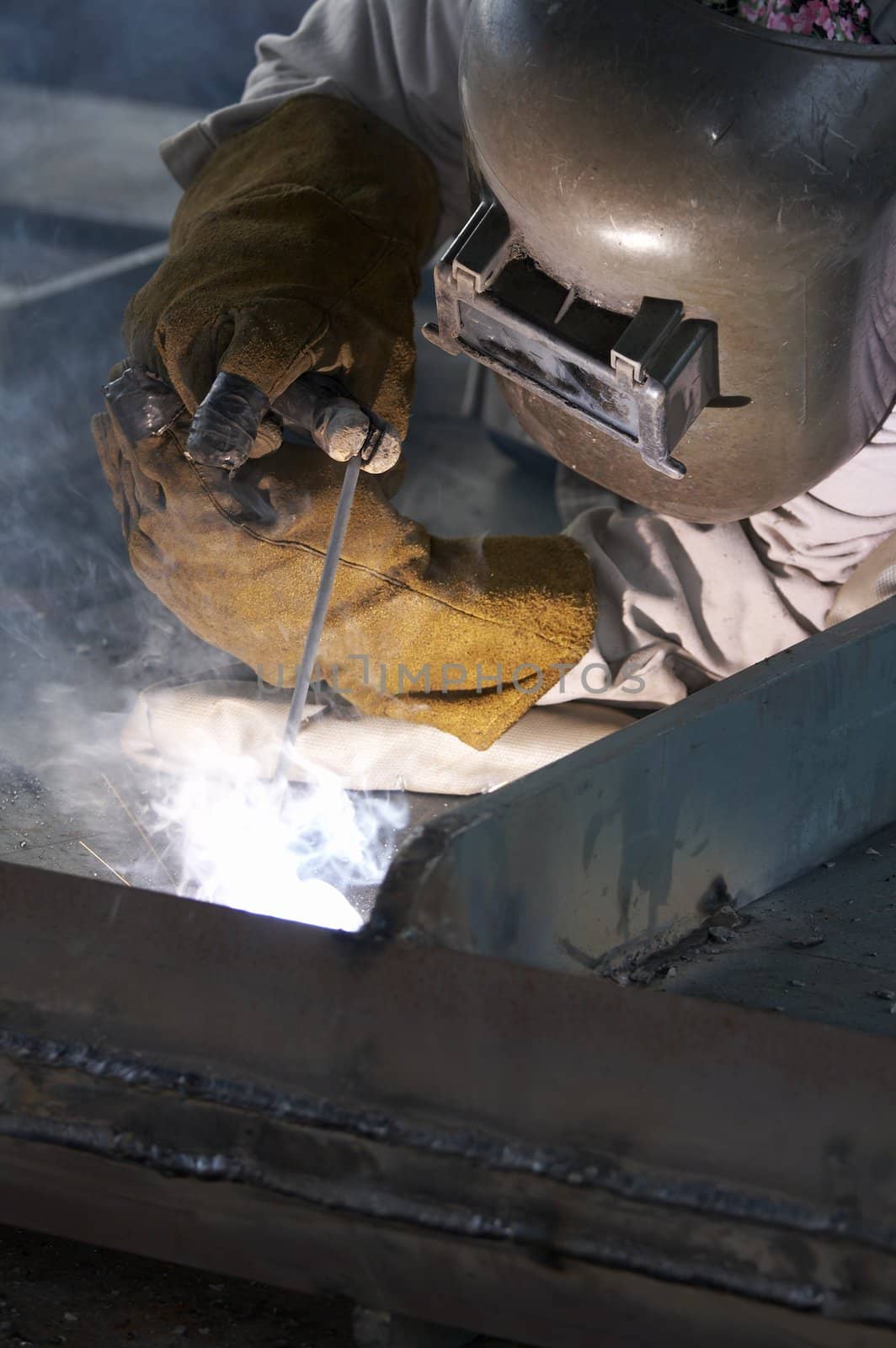 a welder working at shipyard during day shift