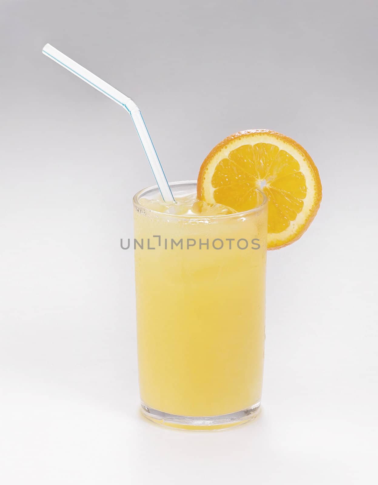 glass of orange juice on the plain background