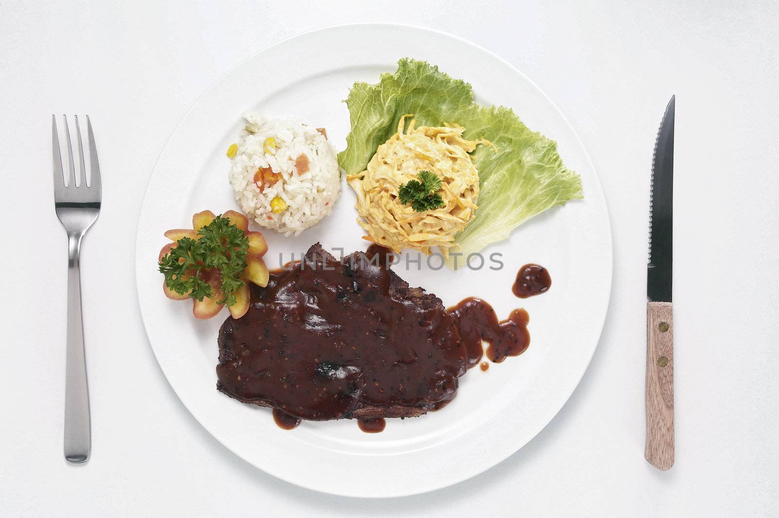 steak with rice and coslaw ready to serve