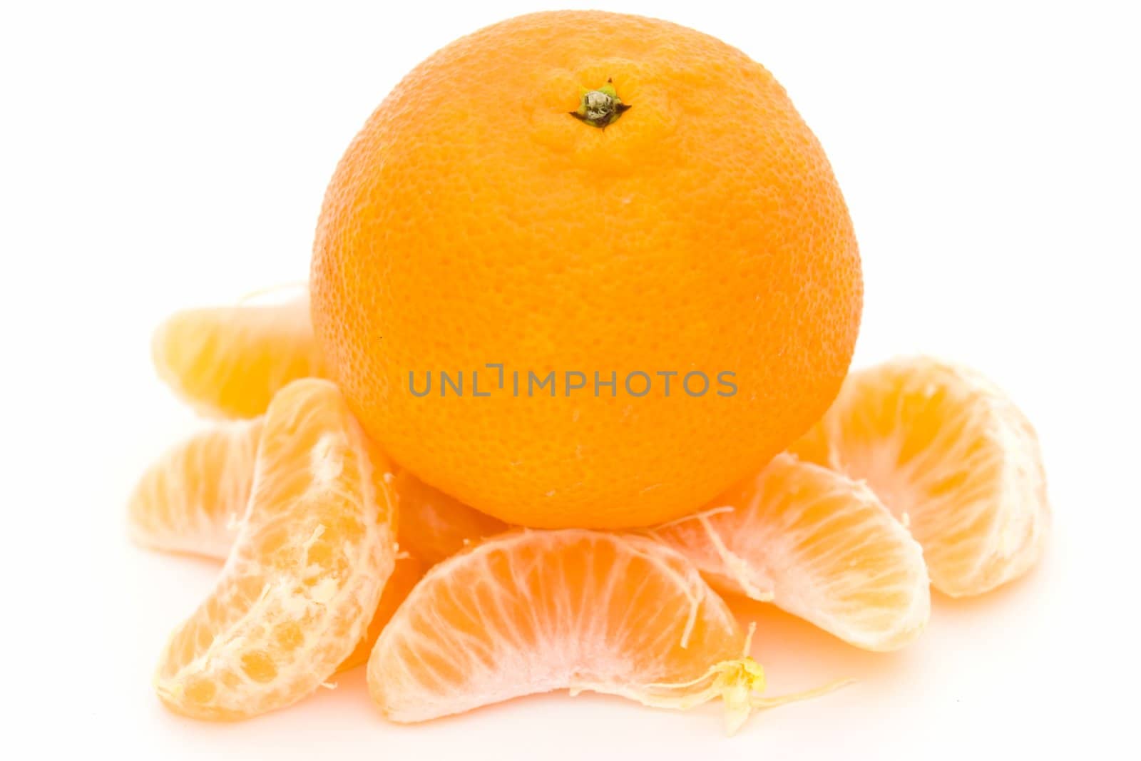 mandarin and some tangerine segments on a white background