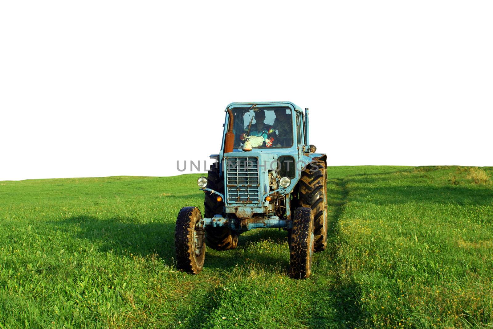 Isolated tractor on a meadow.