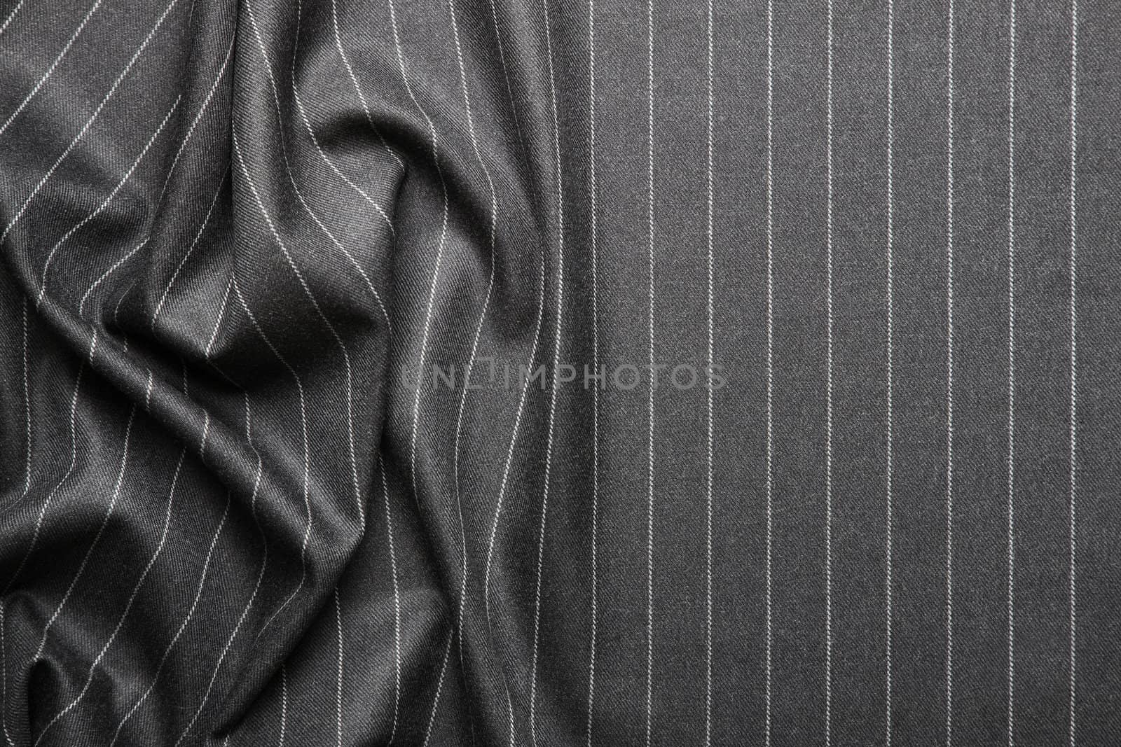 High quality pin stripe suit background texture with folds and copy space