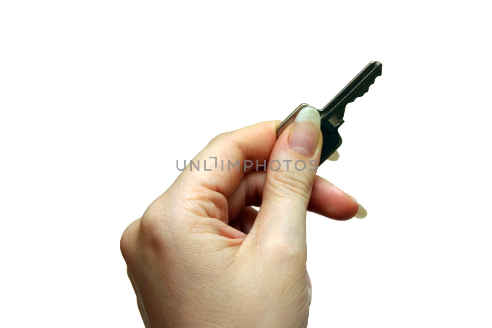 Girl`s hand with a key isolated on white.