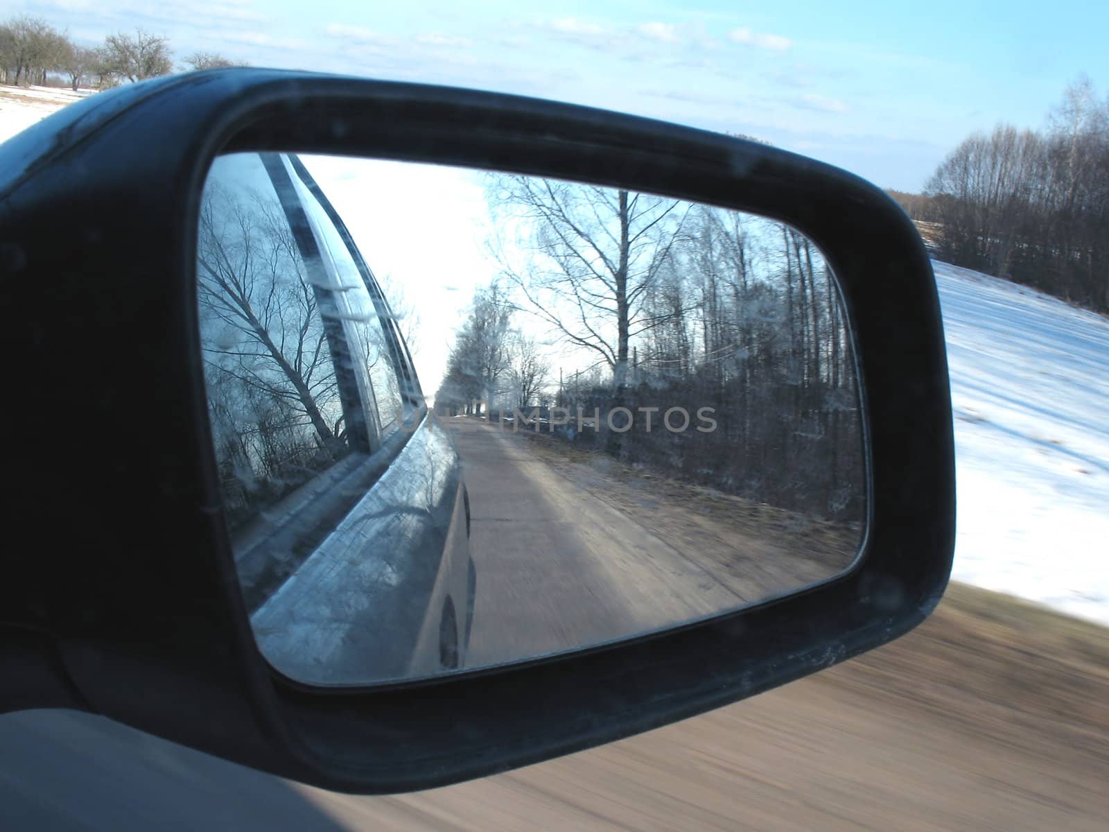 Side mirror view from inside car.