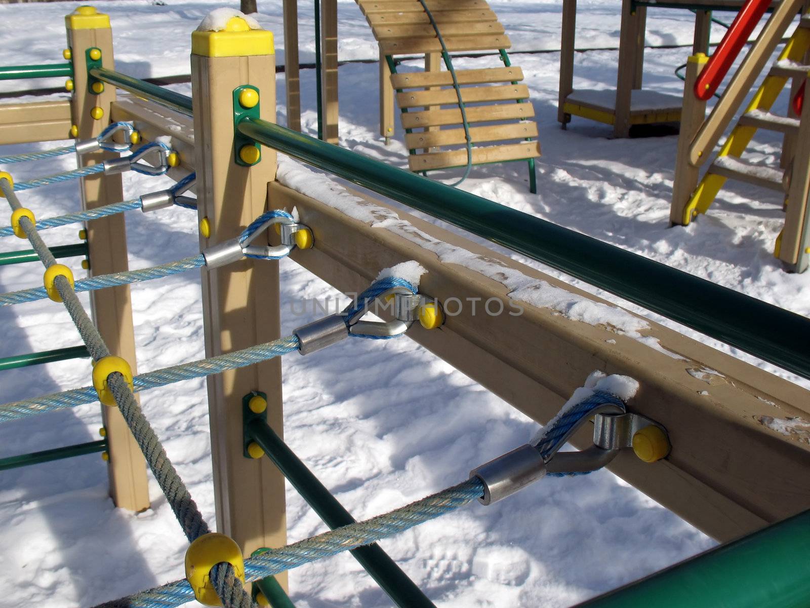 Grate of steel wires on a family playground.
