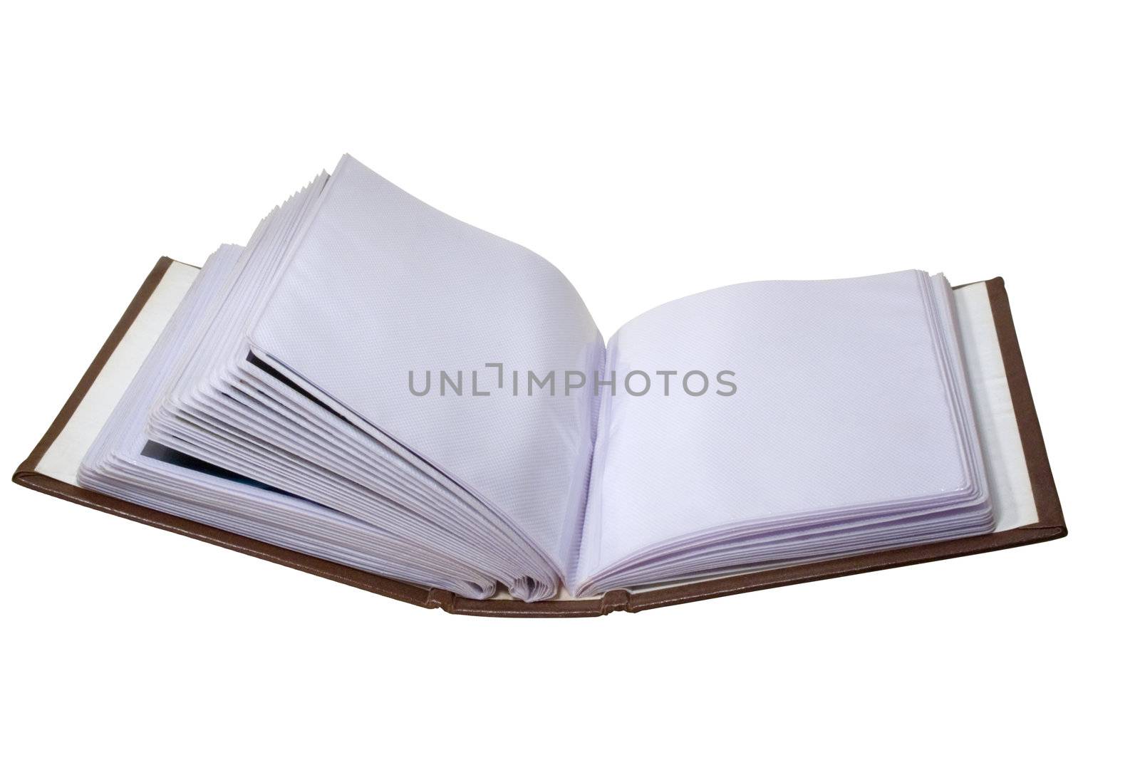 The opened brown photo album on white background. Close-up.