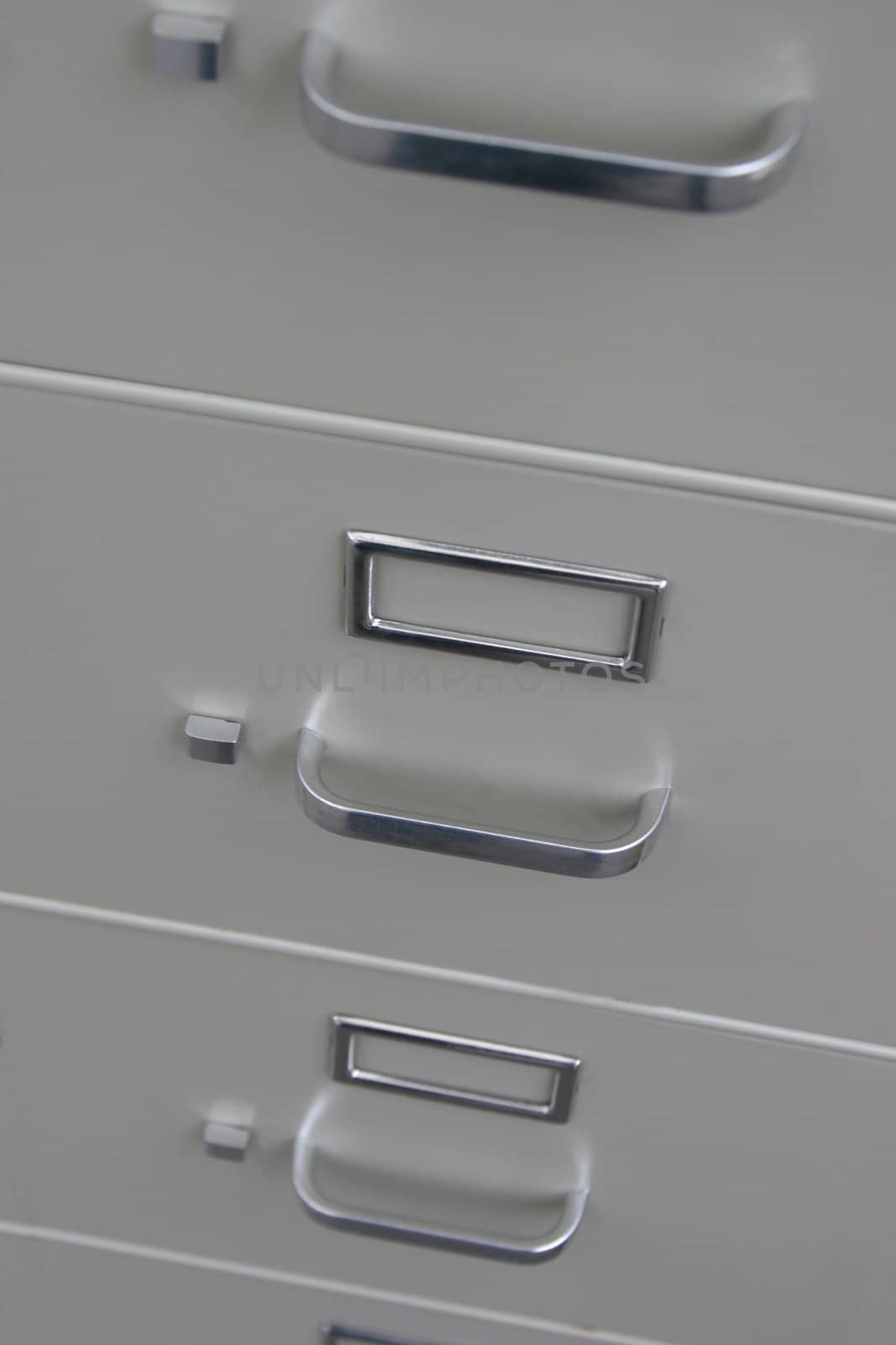 Old fashioned filing cabinet with blank label slots