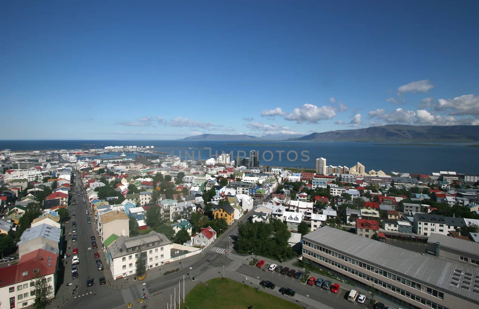 Aerial view of Reykjavik city overlooking the harbor and Mt. Esja
