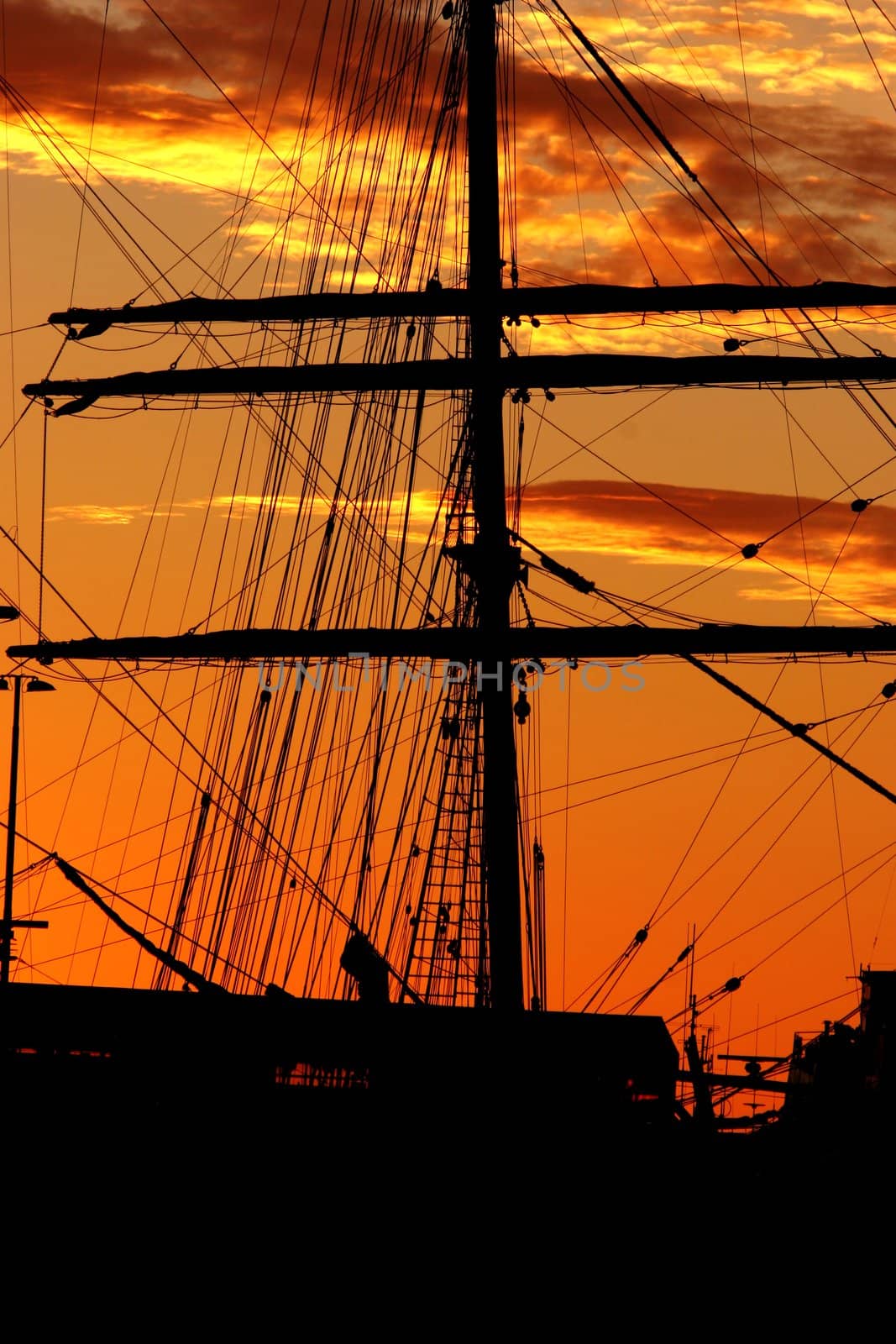 Silhouette of a schooner against the sunset