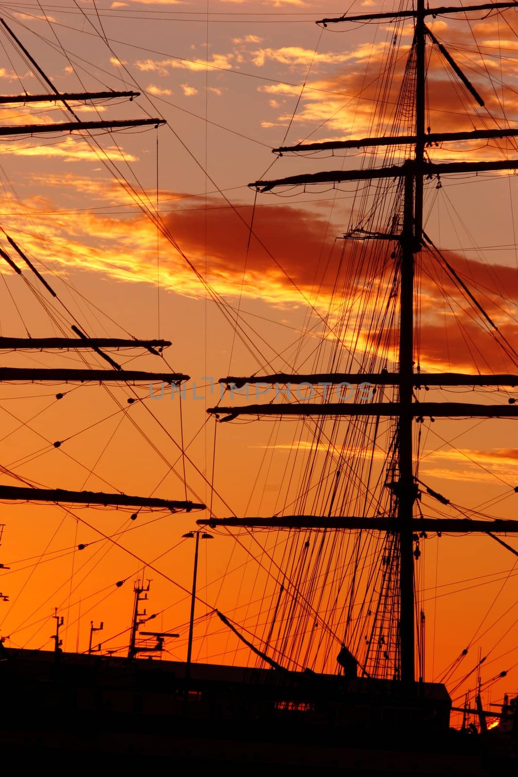 Silhouette of a old schooner against the sunset